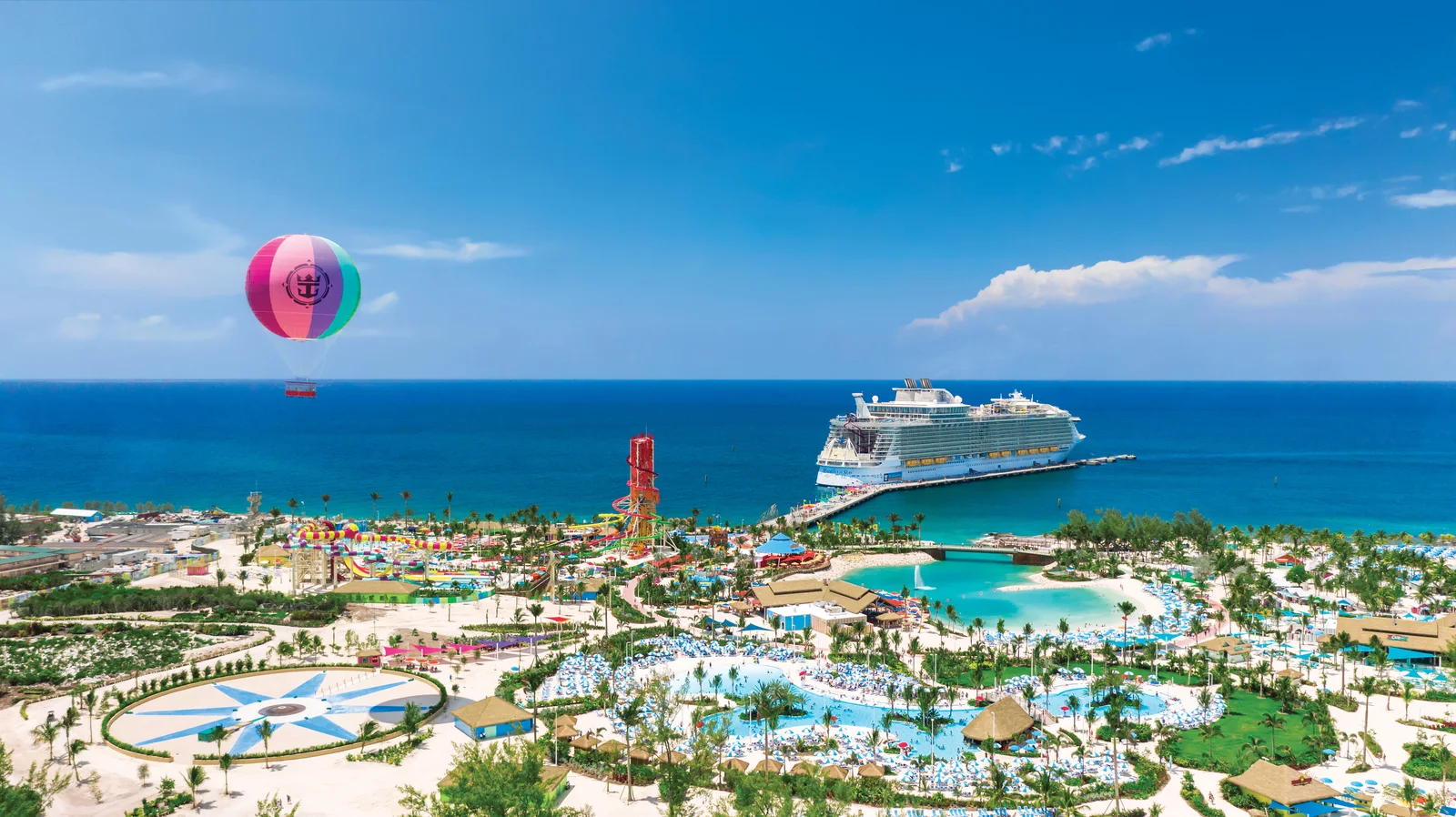 Aerial view of Perfect Day at CocoCay private island with Royal Caribbean ship docked alongside